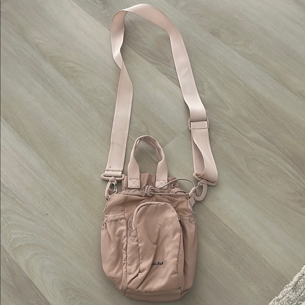 Calpak water bottle bag in blush pink
